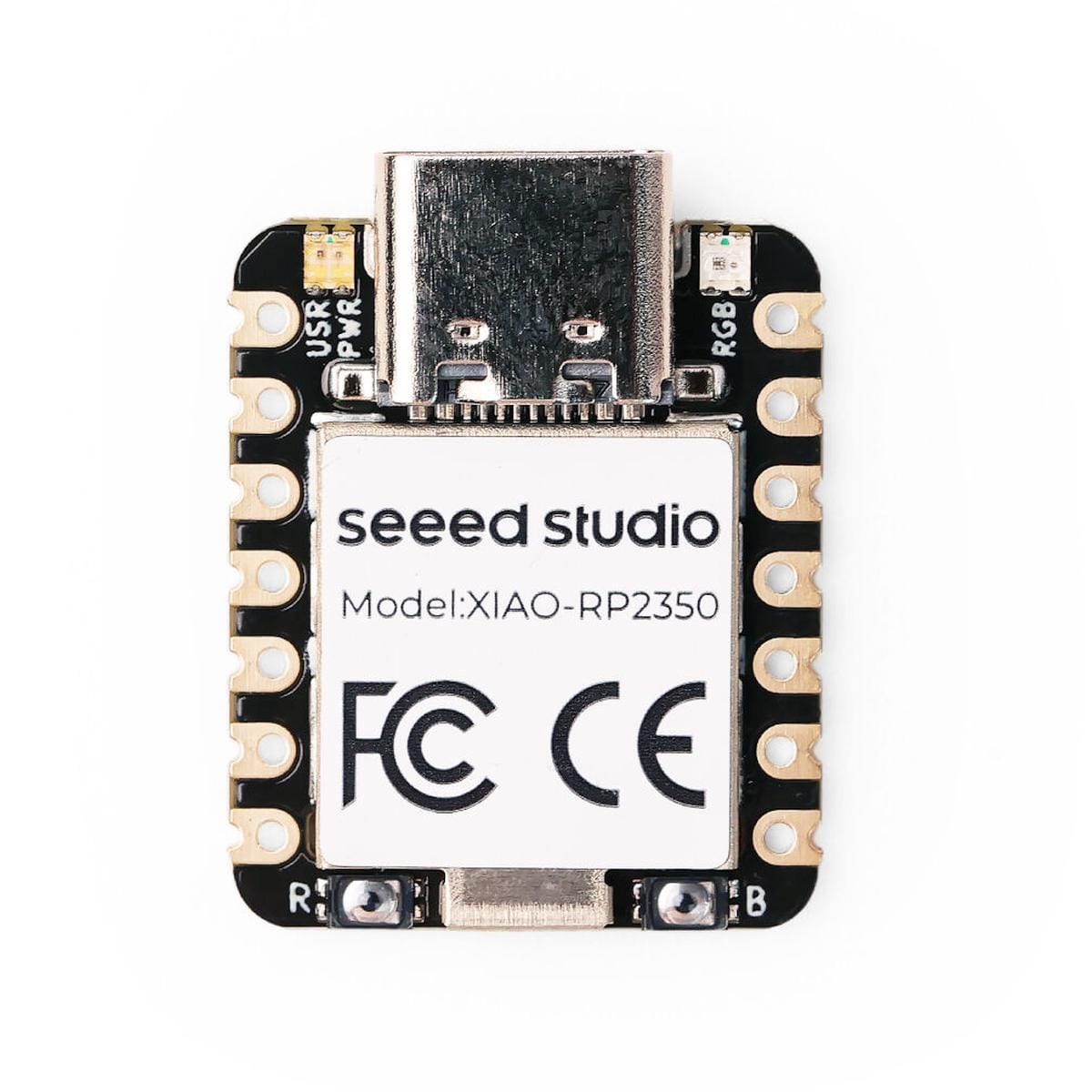 Seeed Studio XIAO RP2350 fejlesztőpanel szemből, felül USB-C aljzattal, kétoldali aranyozott kontaktusokkal, alsó R és B jelölésű gombokkal és központi árnyékolással.