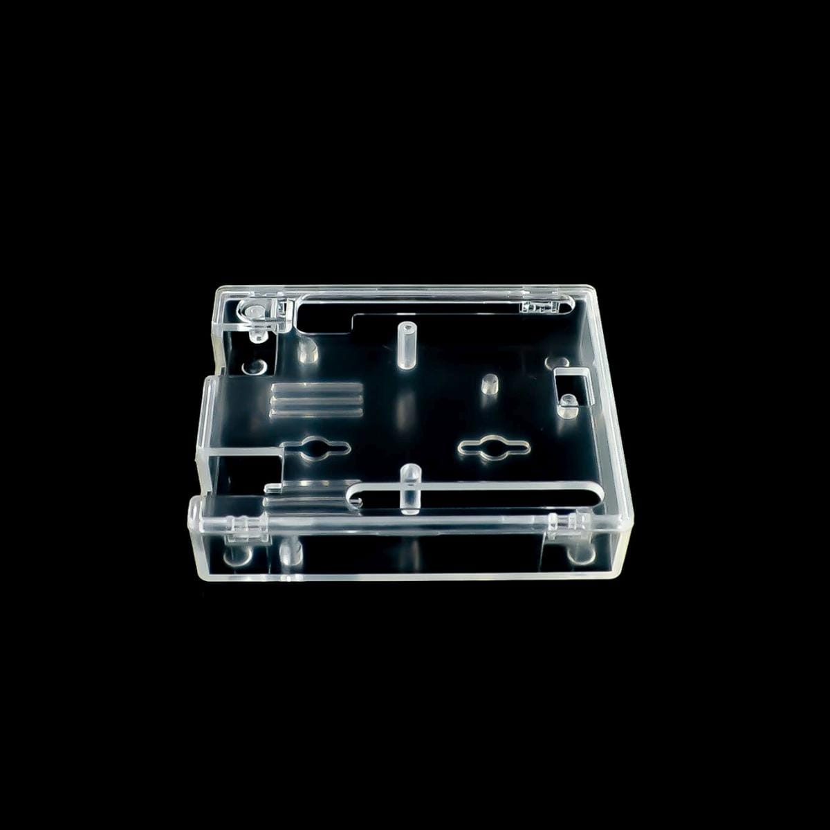 Áttetsző ABS ház Arduino UNO R3 fejlesztőpanelhez, szabadon hagyott tüskesorokkal, USB- és tápcsatlakozóval, valamint elérhető reset gombbal gyakran módosított mikrokontrolleres összeállítások védelméhez.