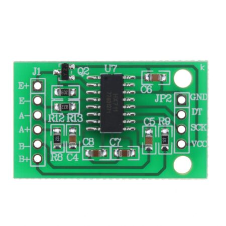 HX711 mérlegcella illesztő panel zöld áramköri lapon, SMD alkatrészekkel, külön tüskesorokkal és jól olvasható csatlakozójelölésekkel, mikrokontrolleres mérés előkészítéséhez közelről fotózva.